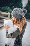 girl carrying a baby