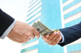 handing over money